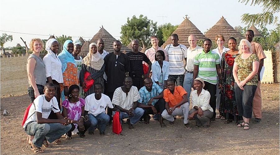 Illinois PRC investigators pose with research team members in Senegal.