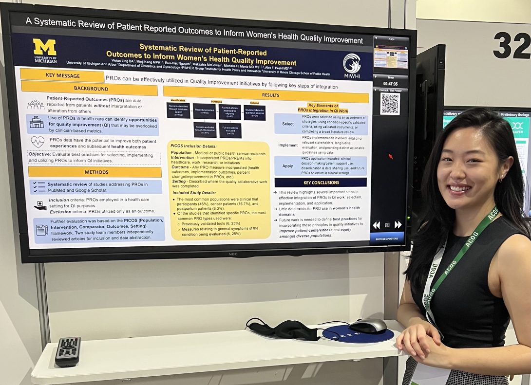 Minji standing in front of her presentation poster 'Systematic Review of Patient-Reported Outcomes to Inform Women’s Health Quality Improvement'